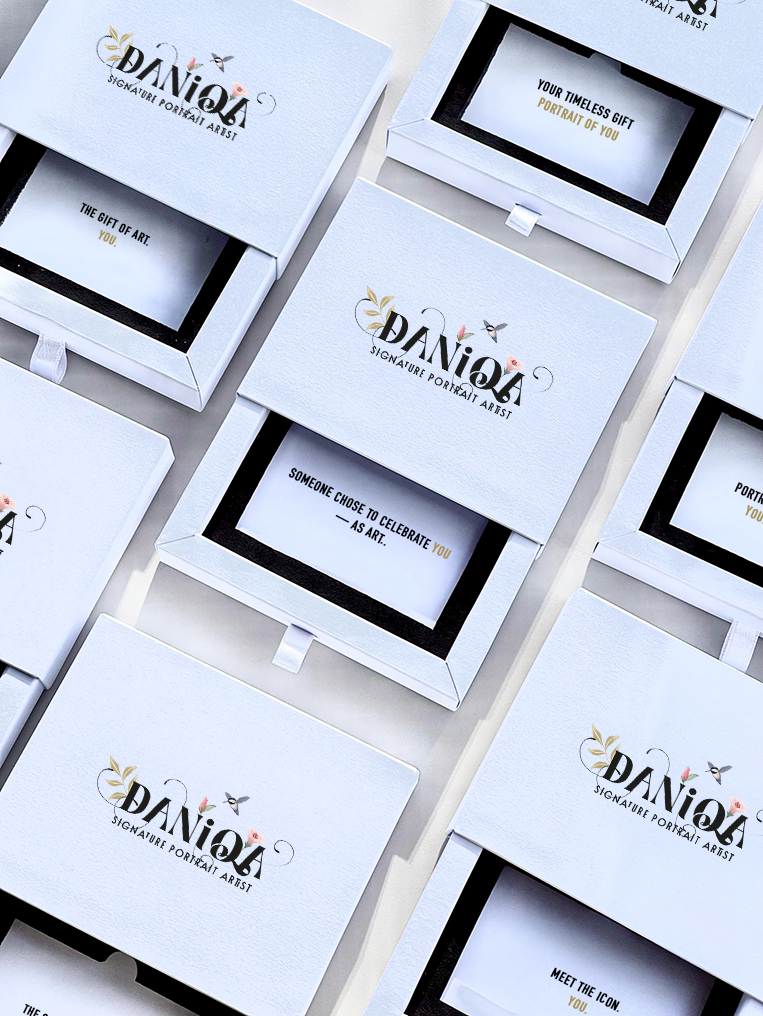 Luxury gift box with portrait voucher inside – elegant packaging for custom hand-painted portrait by Daniqa.